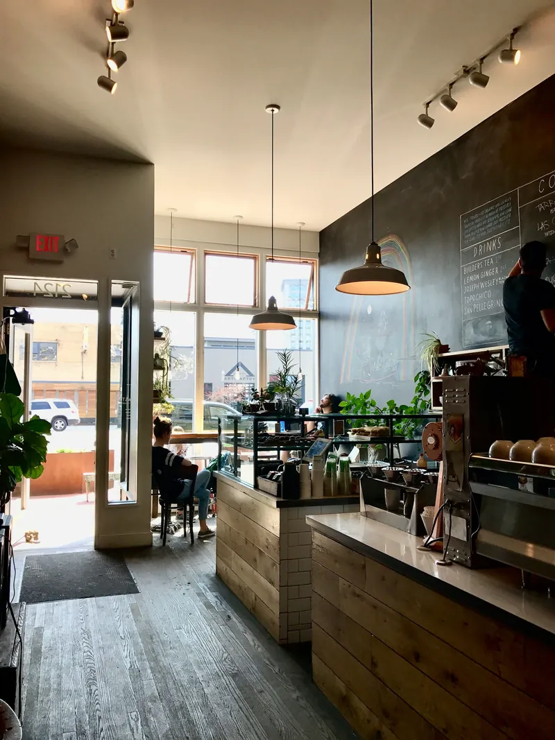 The counter of a bright neighborhood coffee shop